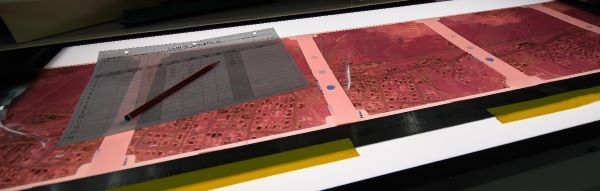 Large format aerial image film on light table